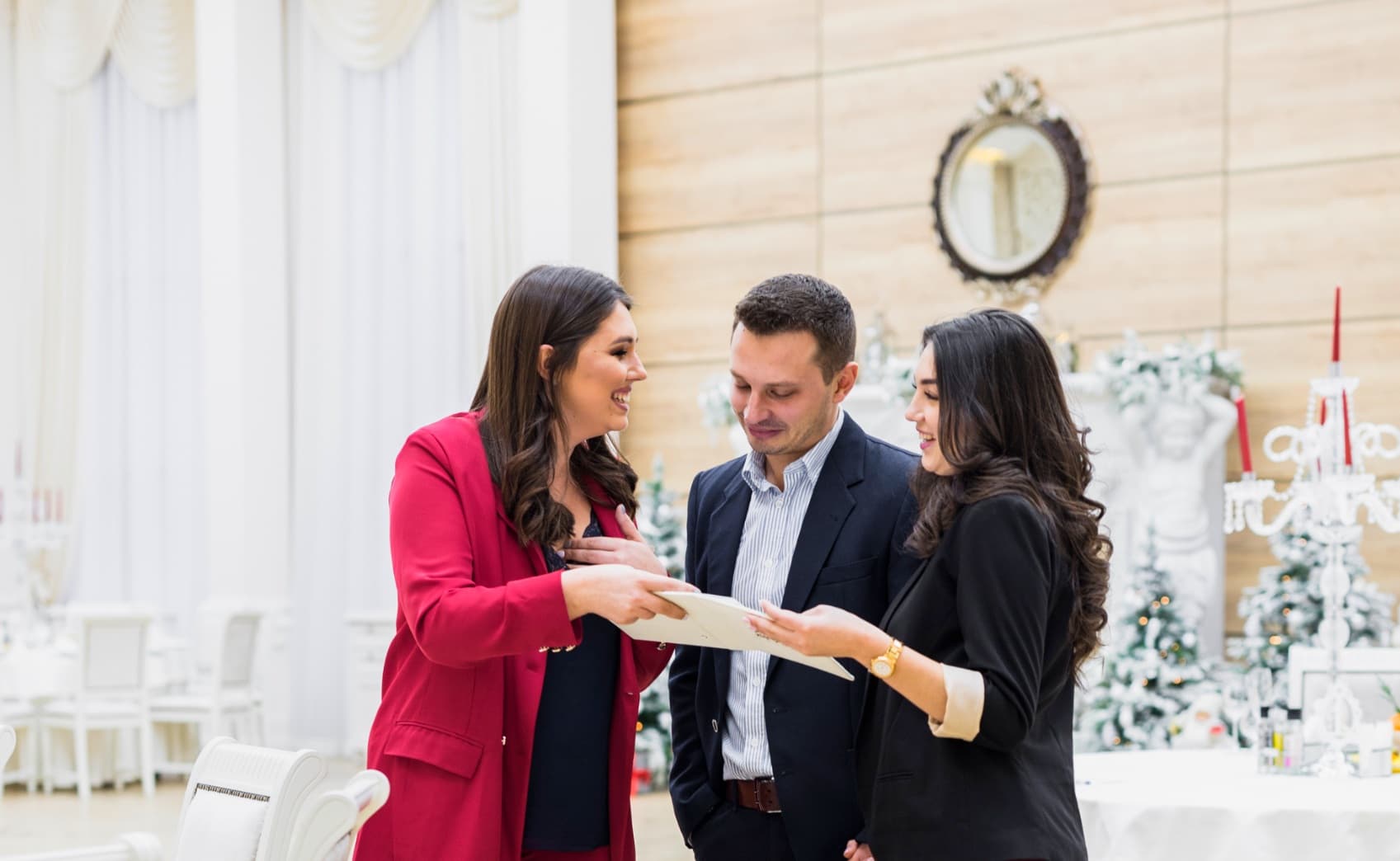 People enjoying an event reception with champagne and appetizers